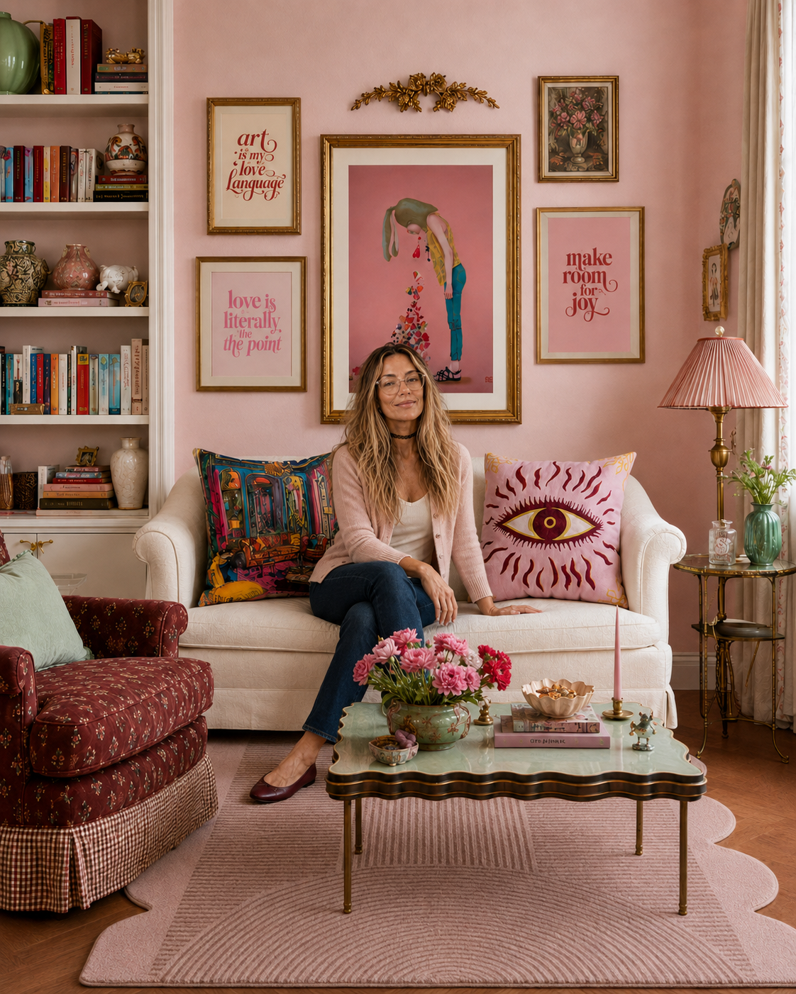 Stephanie in a pink room styled with Maia Homes pillows